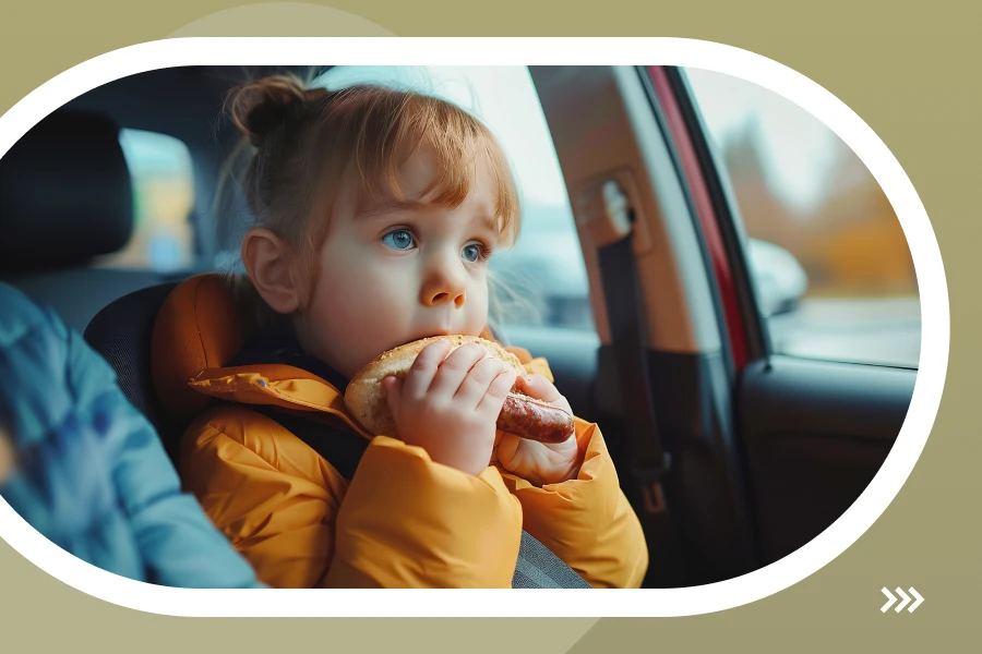 A Little Girl Eat Hamburger In The Car