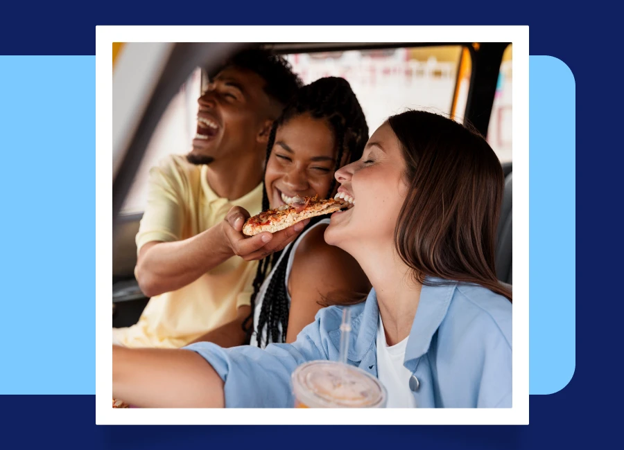 Teenagers are eating pizza while driving a car